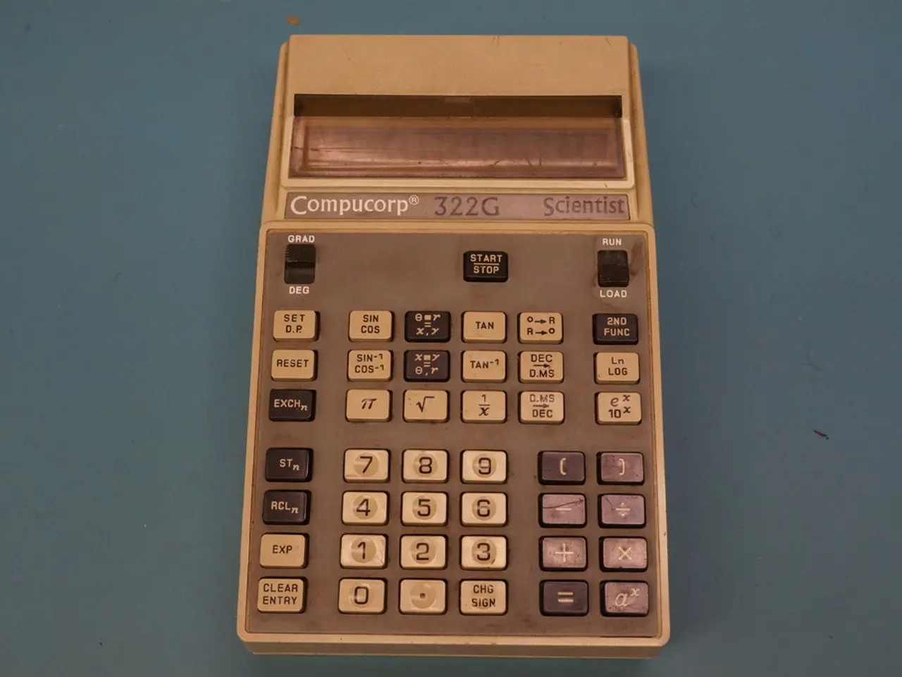 This looks like a calculator. I can see the buttons and the display, which is attached to the...