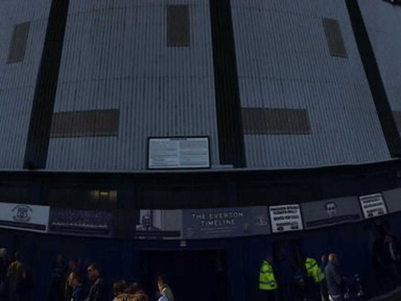 In this picture I can see the buildings. On the right I can see some people were standing near to...