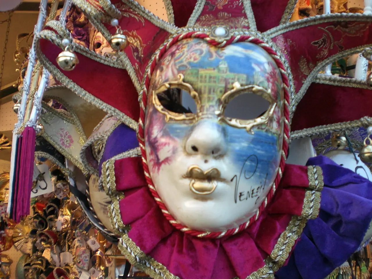 In this picture we can see a mask. On the mask it is written something. Behind the mask, there are...