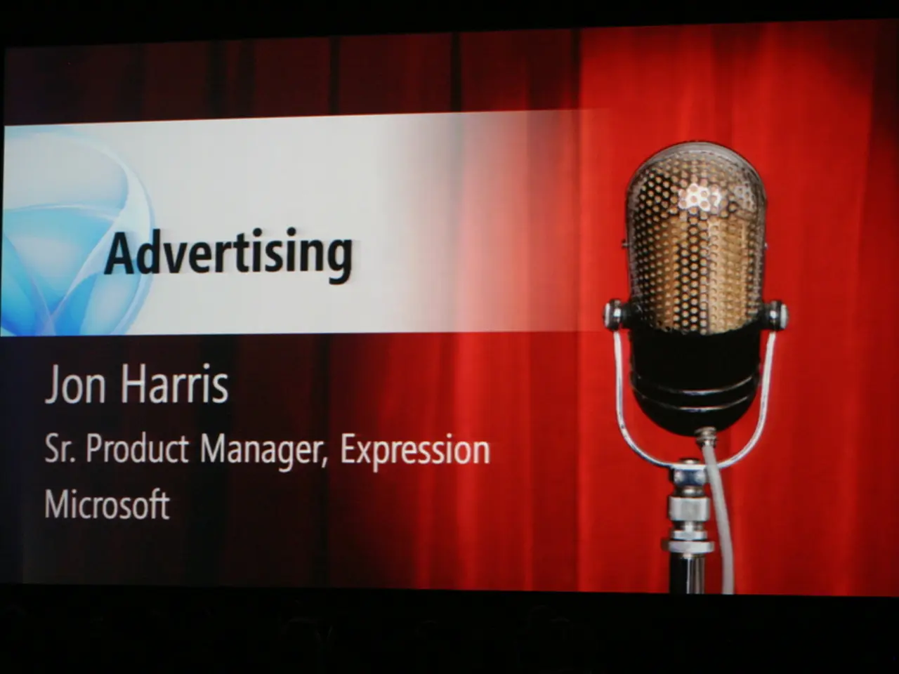 In this picture we can see a screen. On the screen there is an image of a microphone and there are...