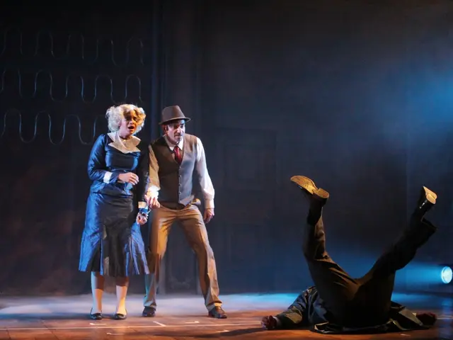 In the picture we can see a man and a woman playing an act, a man is wearing a hat which is black...