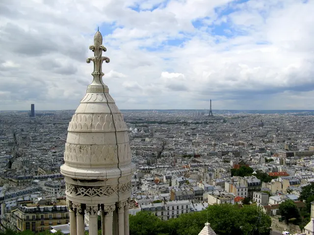 This image is taken from the top, where we can see the city which includes, towers, buildings,...