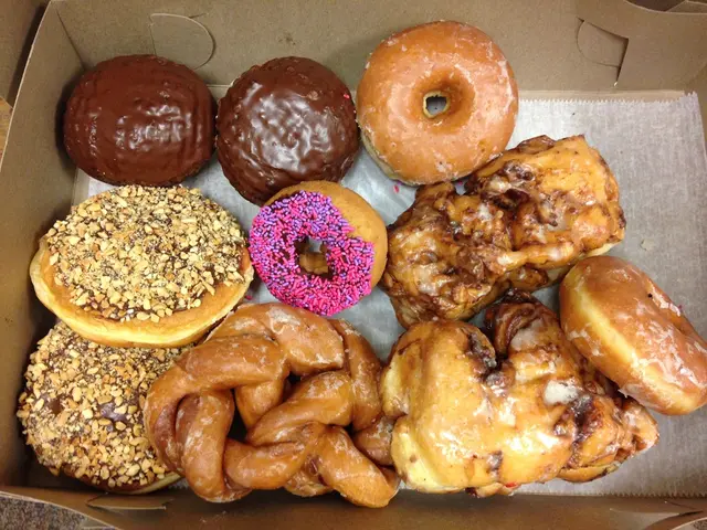 In this image there is a box, in that box there are sweets.