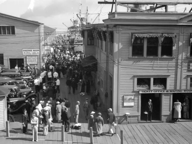 In this image in the center there are persons standing and walking. On the right side there are...