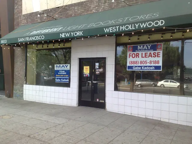 In this image, we can see a shop, we can see glass windows, we can see posts on the windows, we can...