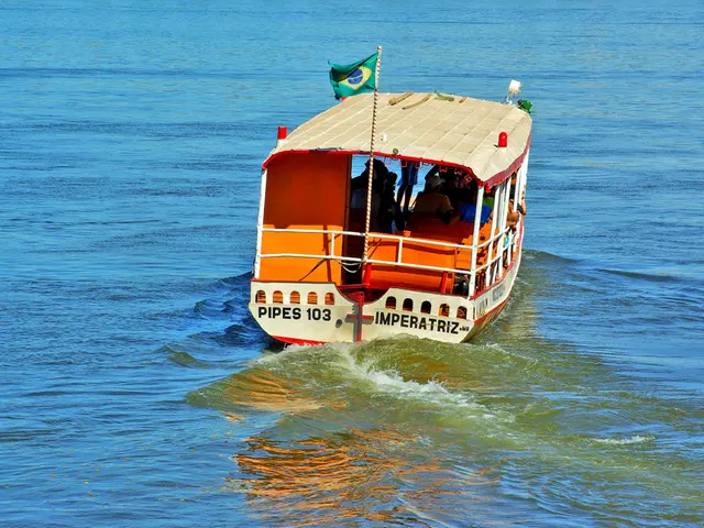 In this image in the center there is a boat sailing on the water with the persons inside it and...