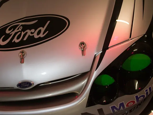 In this picture we can see a vehicle with stickers and a logo on it.