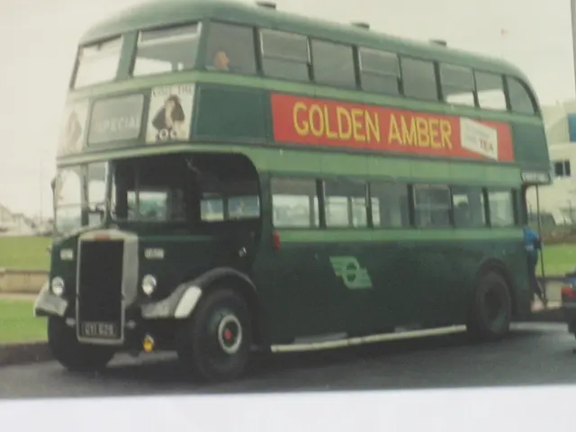 In the picture I can see a double decker bus which is in green color and there is something written...