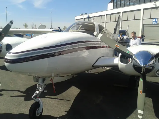 In this picture we have small airplanes on the ground and there are people looking at them. The sky...